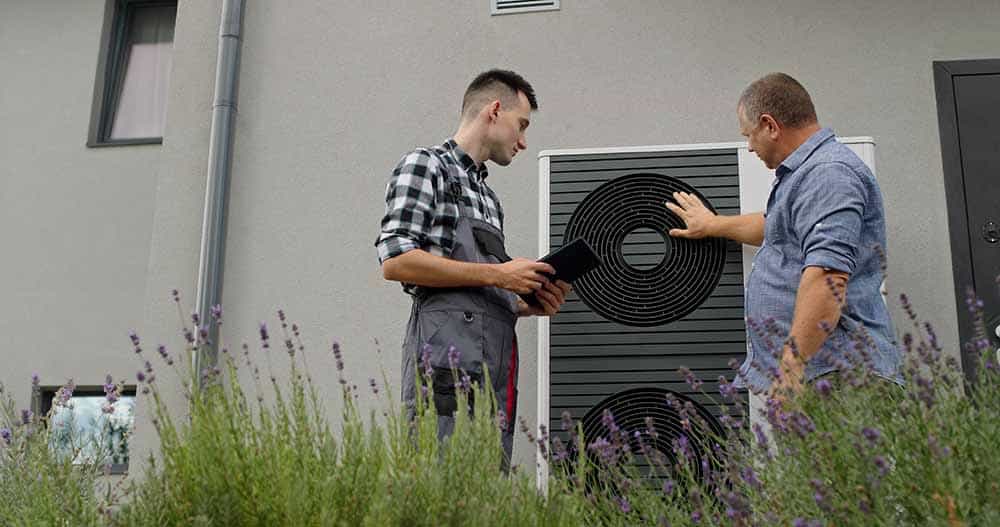 A technician consulting with a homeowner.