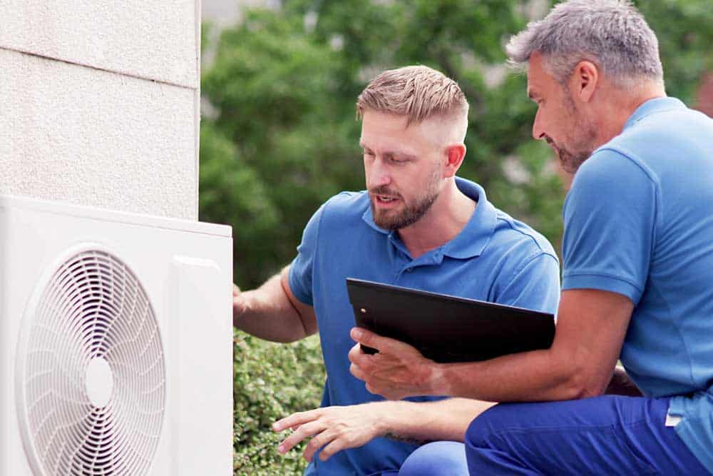 A technician inspecting a heating system, showcasing professionalism and attention to detail.