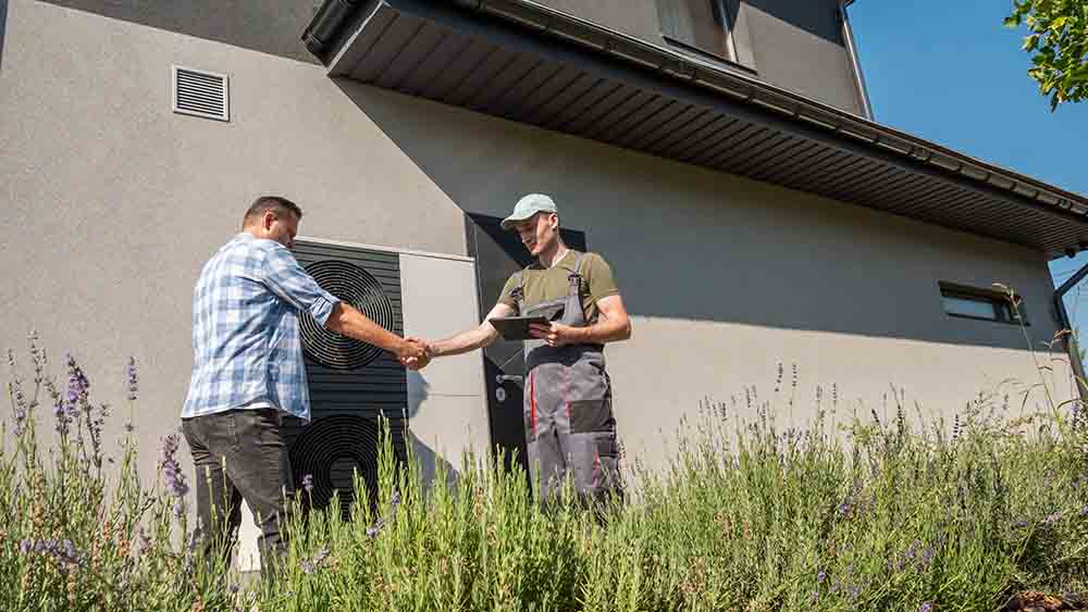 A homeowner discussing AC repair options with a technician, showcasing trust and professionalism.