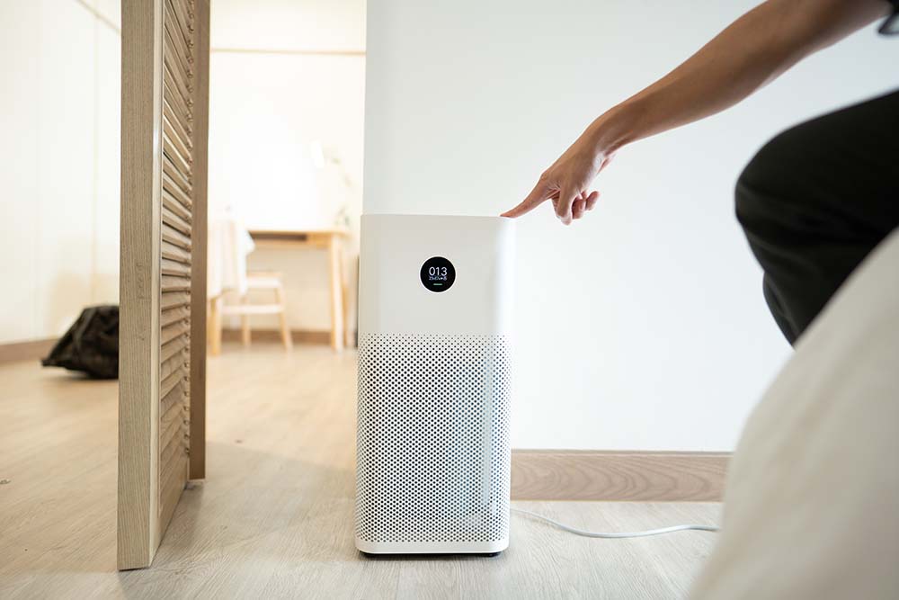 A technician installing a humidifier