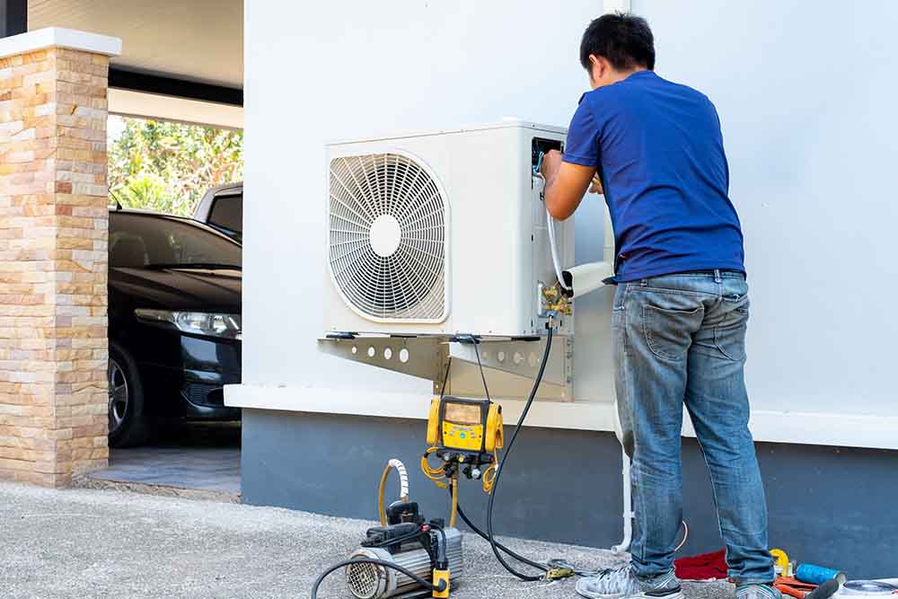 A technician installing a new heating system