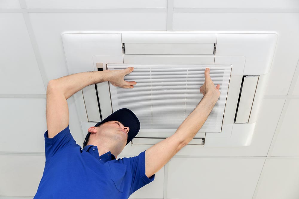 A technician testing an indoor air quality system