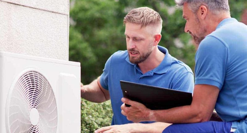 A technician inspecting a heating system, showcasing professionalism and attention to detail.