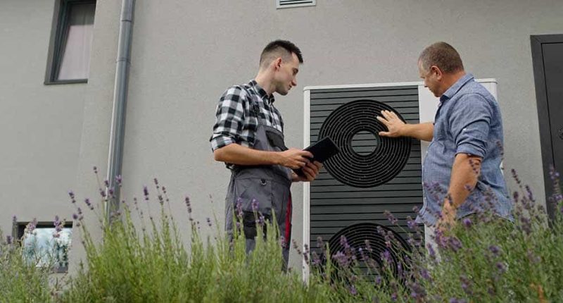 A technician consulting with a homeowner.