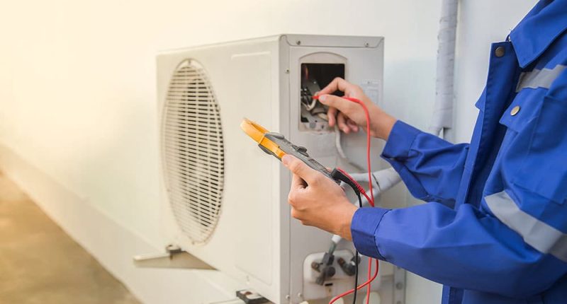A technician inspecting a heating system.